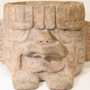 A stone sculpture resembling a human face